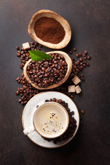 Coffee cup, beans and ground powder