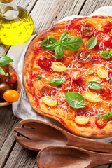 Pizza with tomatoes, mozzarella and basil