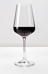Glass of red wine isolated on white background