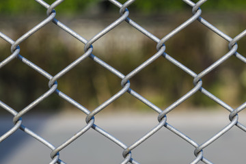 Naklejka premium Metal wire mesh of house fence