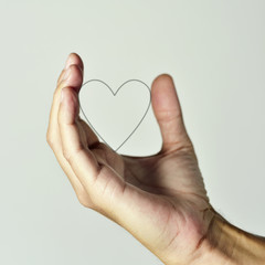 Obraz premium heart in the hand of a man