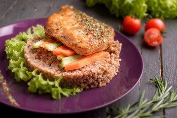 Hot dish with buckwheat and meat steak and cherry tomato