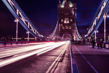 Tower Bridge in London at night with car traffic light trails