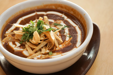 Tomato soup and red beans with cream and spices, Mexican food on a white table background. - 136190079