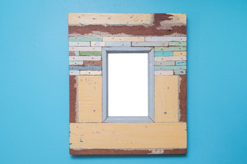 Empty vintage frame isolated on blue cement wall.