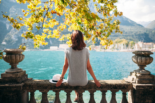 Young woman relaxing on beautiful Garda lake