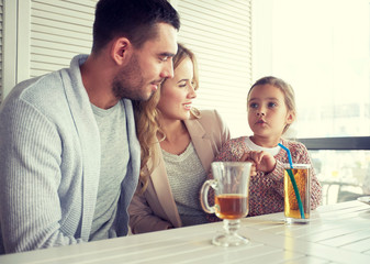 happy family having dinner at restaurant or cafe