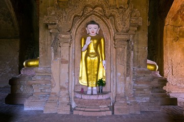 Naklejka premium Standing golden Buddha statue in Myanmar