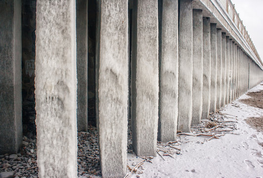columns covered with ice on seacoast