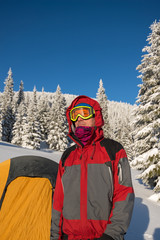 Fototapeta na wymiar Traveler, man wearing a jacket with a hood and goggles