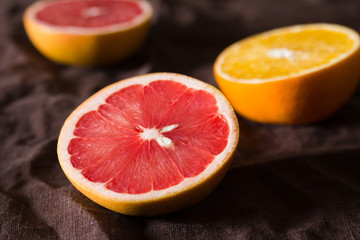 Fototapeta na wymiar various types of citrus fruit on a dark background