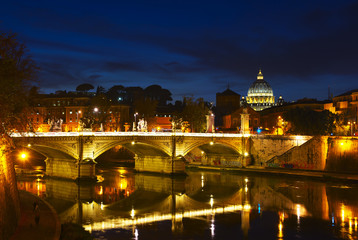 Fototapeta na wymiar Night view of Ponte Vittorio Emanuele II bridge across Tiber river, Rome, Italy