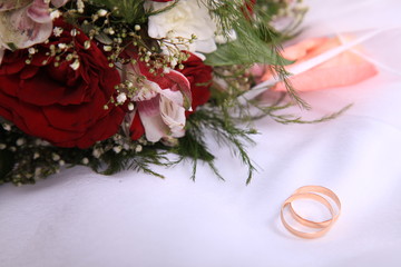 Wedding rings and bouquet