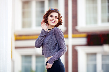 beautiful charming young girl posing for the camera. smiling