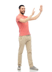 happy man touching something imaginary