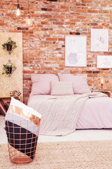 Bedroom with red brick wall