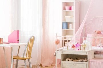 Functional pink room with bed