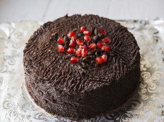 Chocolate cake decorated with pomegranate seeds