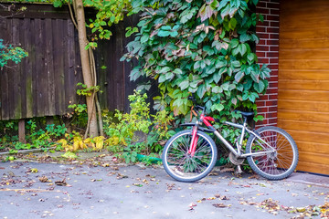 Fototapeta na wymiar The bicycle at garage gate