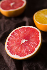 Fototapeta na wymiar various types of citrus fruit on a dark background