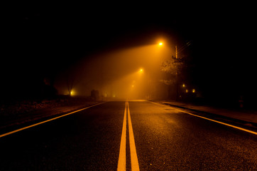 A Fog Covered Road at Night 