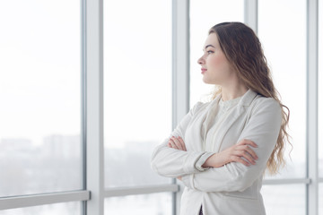 portrait of beautiful young business woman with makeup posing by