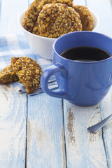 coffee oatmeal cookies breakfast kitchen blue wooden background
