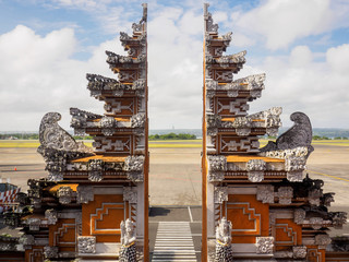 The Balinese traditional gate at Denpasar International airport, also known as Bali Ngurah Rai International Airport, Bali island, Indonesia. © Artaporn Puthikampol