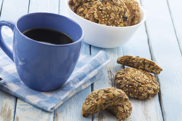 coffee oatmeal cookies breakfast kitchen blue wooden background
