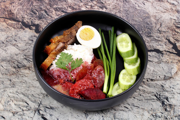 Jasmine rice with meat and boiled egg topped red sweet sauce .