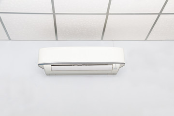 Air conditioner on wall background in white room,conditioning