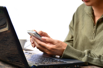 woman using smart phone and laptop for connecting with people