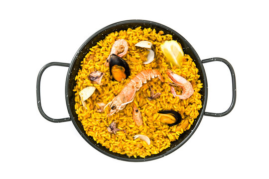 Traditional spanish seafood paella, isolated on white background
