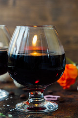 Romantic dinner drink - wine or brendy in glass.