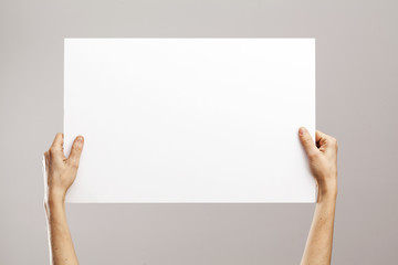 Young woman hands holding cardboard