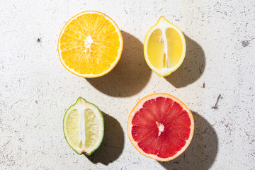 different kinds of citrus on white background