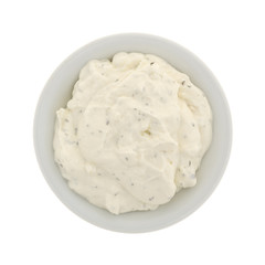 Top view of  a small bowl of French onion dip isolated on a white background.