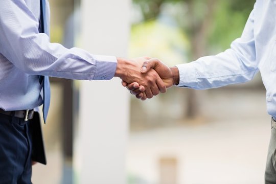 Business executives shaking hands