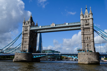 View of London bridge on nice sunny day with dramatic clouds