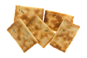 Serving of seasoned rosemary and olive oil crackers top view isolated on a white background.