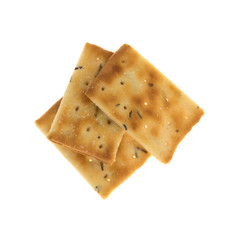 Top view of three seasoned rosemary and olive oil crackers isolated on a white background.