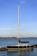 A beautiful sailboat moored in a dock