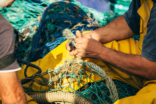 Man working with fishing net