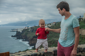 Father with baby on the coast of Los Realejos, north of Tenerife, Canary Islands