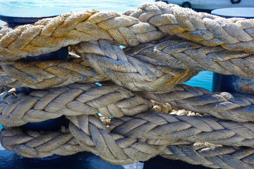 Fototapeta na wymiar thick marine rope tangled on poles