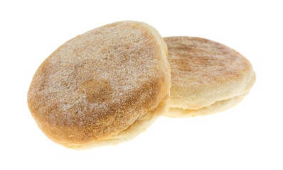 Two freshly baked English muffins isolated on a white background.