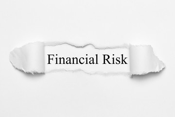 Fototapeta premium Financial Risk on white torn paper