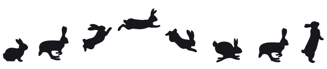 jumping Silhouettes of Easter bunnies black