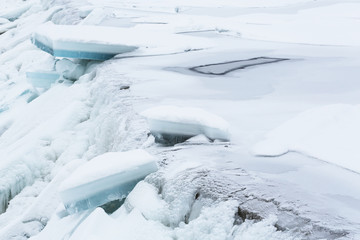 Ice blocks falling down a waterfall in the winter
