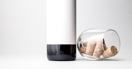 Wine bottle with glass and corks